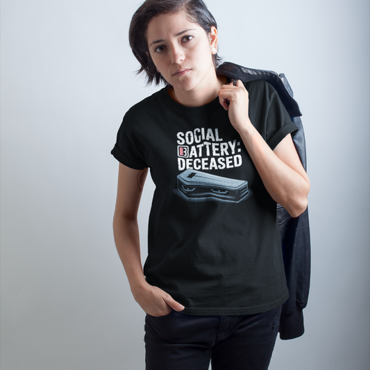 Person wearing a black t-shirt with text and graphic design on a plain background