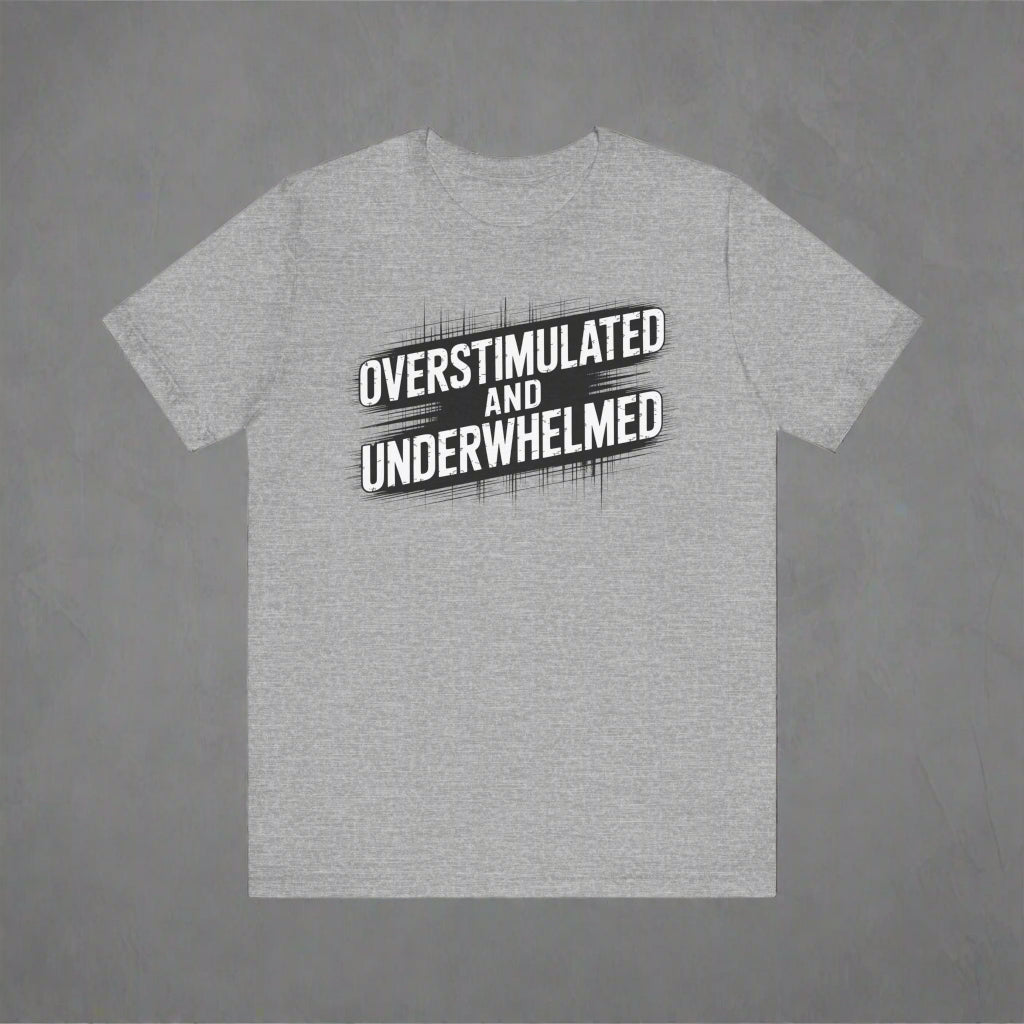 Gray t-shirt with 'OVERSTIMULATED AND UNDERWHELMED' text on a white background