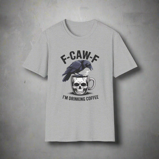 Gray t-shirt with a graphic of a crow on a skull with a coffee cup and text 'F-CAW-F I'M DRINKING COFFEE' on a white background.