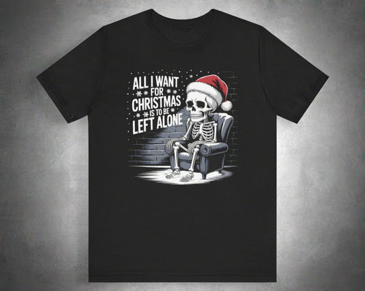 Black t-shirt with a skeleton wearing a Santa hat and text 'All I want for Christmas is to be left alone' on a white background.