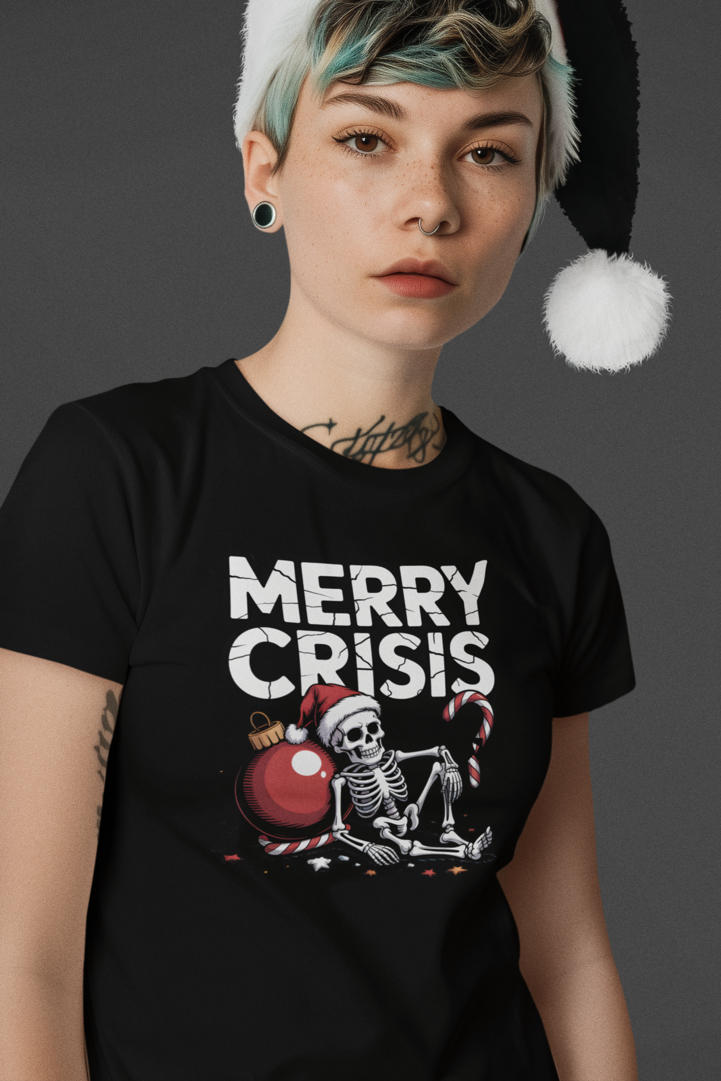 Person wearing a black t-shirt with 'Merry Crisis' graphic and a Santa hat on a dark background